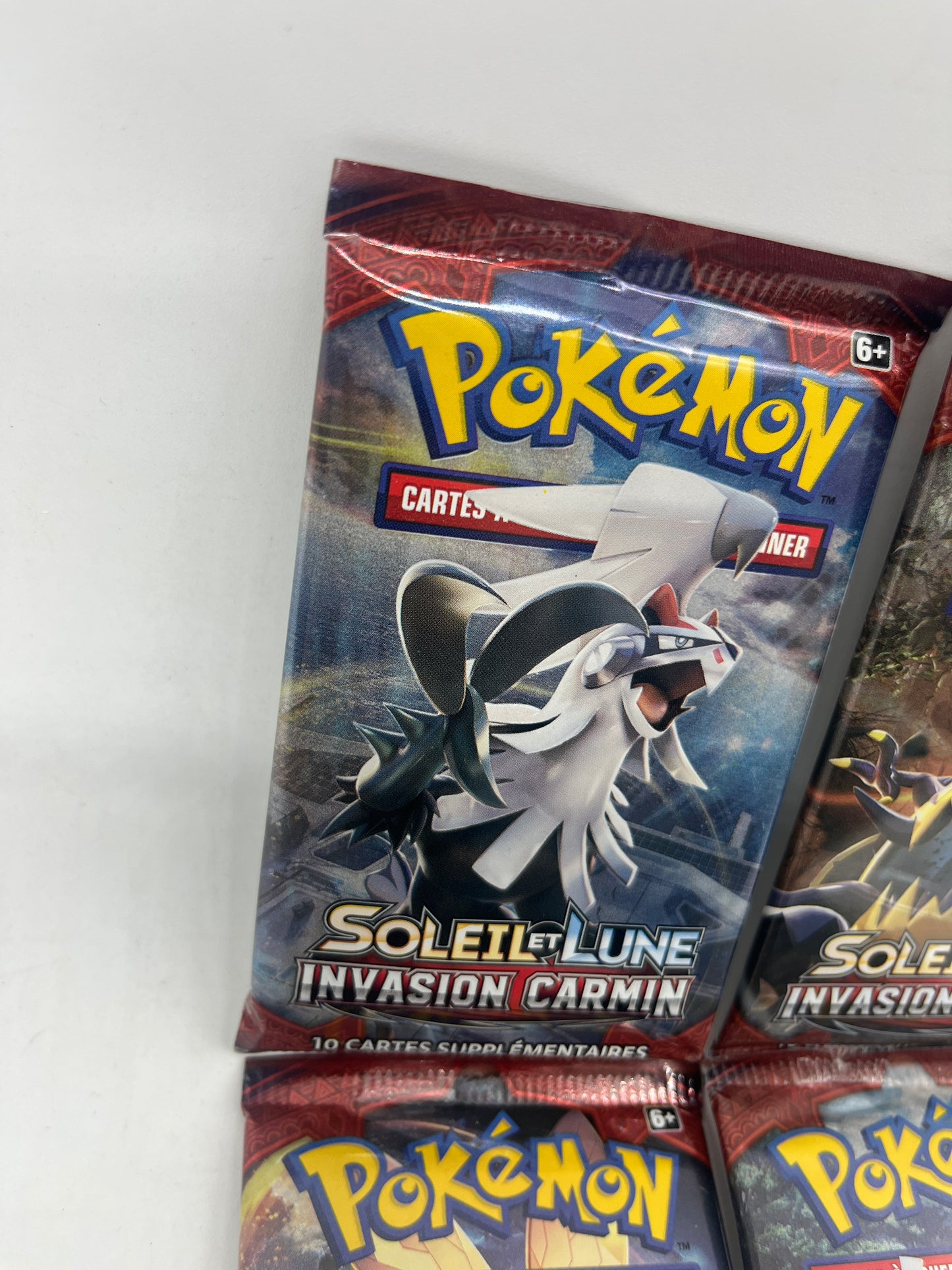 Lot de 4 paquets carte Boosters Pokémon Artset Série  SL4 soleil et Lune invasion carmin
